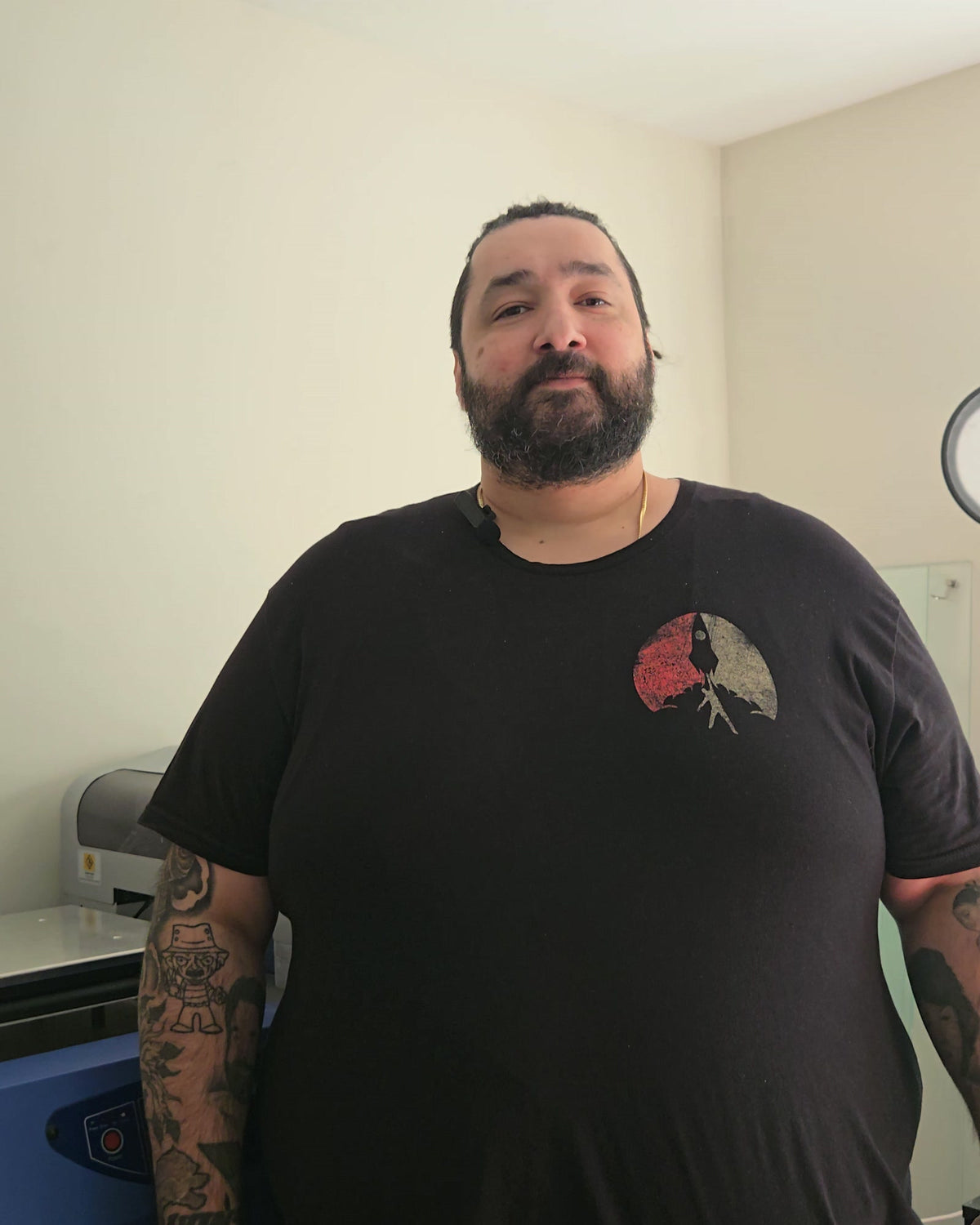 Joseph Hall, founder of 4th Dimension Apparel, in his Delaware print shop