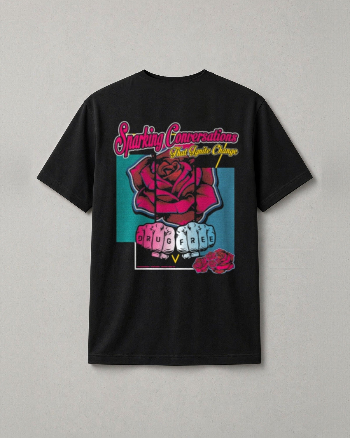 Drug Free t-shirt back print: neon script Sparking Conversations That Ignite Change over a red rose and two fists with DRUG FREE on the knuckles
