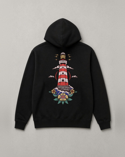 Hope in Darkness hoodie back print: full-color lighthouse shining over the water with roses at its base