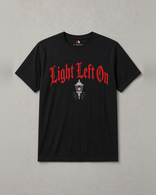 Light Left On t-shirt: red blackletter Light Left On across the chest with a small lantern below, black tee